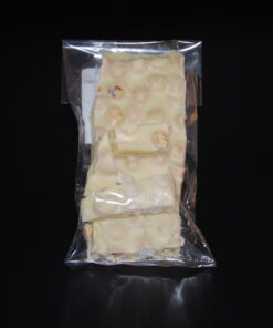 weiße Schokolade mit Haselnüssen, als Bruchschokolade zu 100g abgepackt