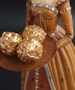 dunkle Trüffelpraline mit Bronze-Puder