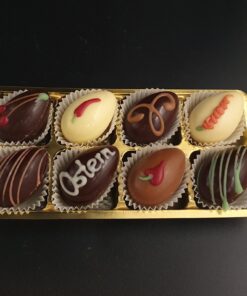 Exklusiven Osterei-Pralinen aus Edelkakao-Schokoladen mit verschiedenen Verzierungen und Füllungen im 8er Blister